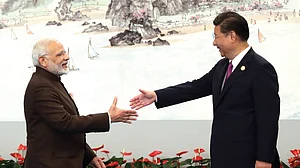 <b>Xiamen, China, September 4, 2017: </b>Prime Minister Narendra Modi shakes hands with Chinese President Xi Jinping prior to the dinner on September 4, 2017 in Xiamen, China