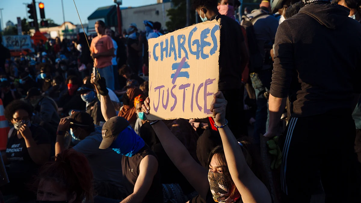 2 US policemen shot during protest, suspect held