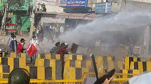 Rajasthan-Haryana border: Cops use water cannon, tear gas as farmers break through barricades