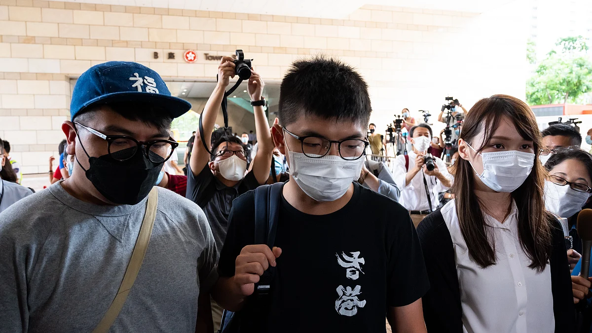 Pro-democracy activist Ivan Lam Long-yin (L), Joshua Wong (C) and Agnes Chow Ting(R)  in Hong Kong, China. (Photo by Billy H.C. Kwok/Getty Images)
