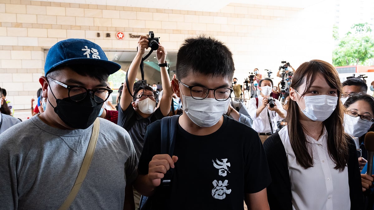 Pro-democracy activist Ivan Lam Long-yin (L), Joshua Wong (C) and Agnes Chow Ting(R)  in Hong Kong, China. (Photo by Billy H.C. Kwok/Getty Images)