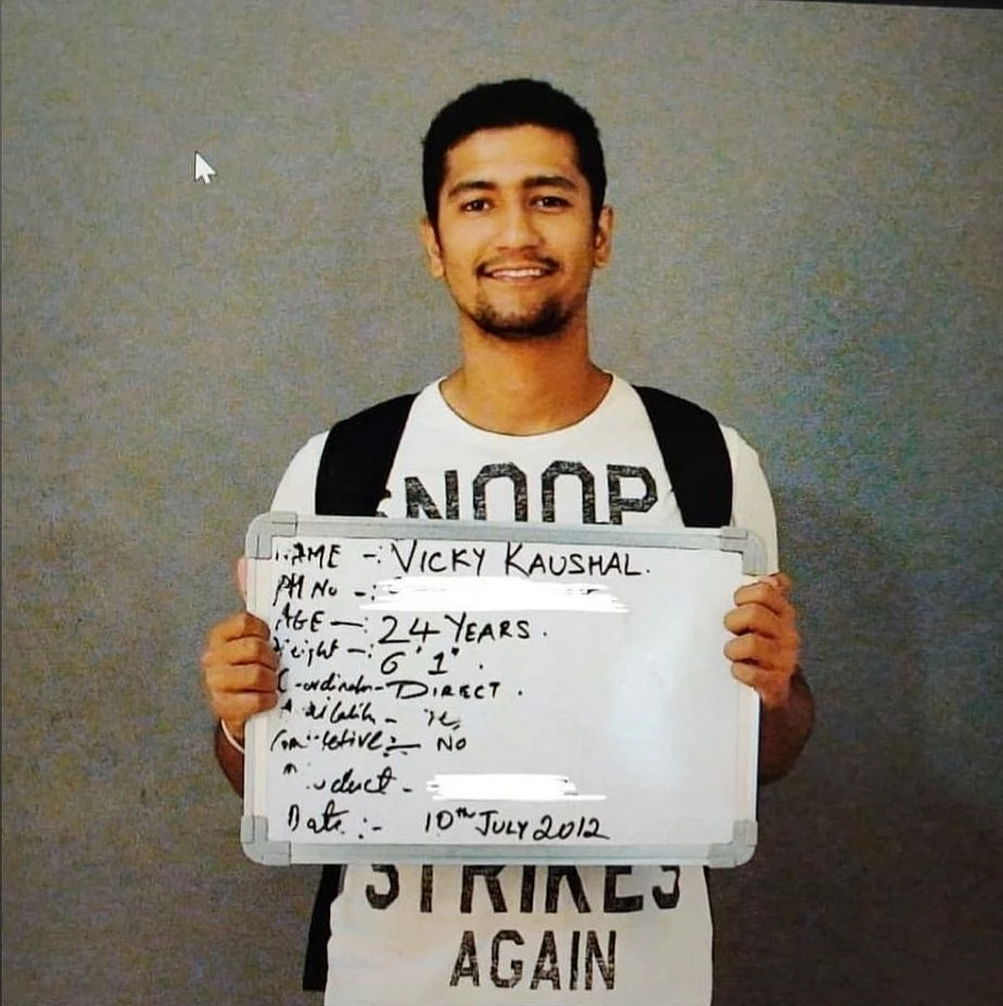 In the picture, Vicky is seen holding an audition whiteboard wearing a white T-shirt.
