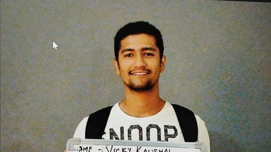 In the picture, Vicky is seen holding an audition whiteboard wearing a white T-shirt.