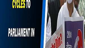 Rahul Gandhi cycles to Parliament in protest of rising fuel prices