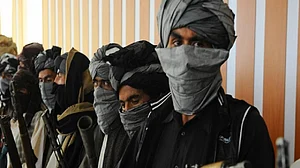 Witness: Taliban hang dead body in Afghan city's main square