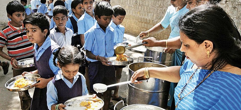 Mid-day meal being served to school children