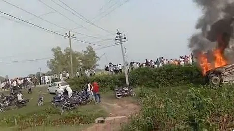 A vehicle torched by angry farmers in Tikunia