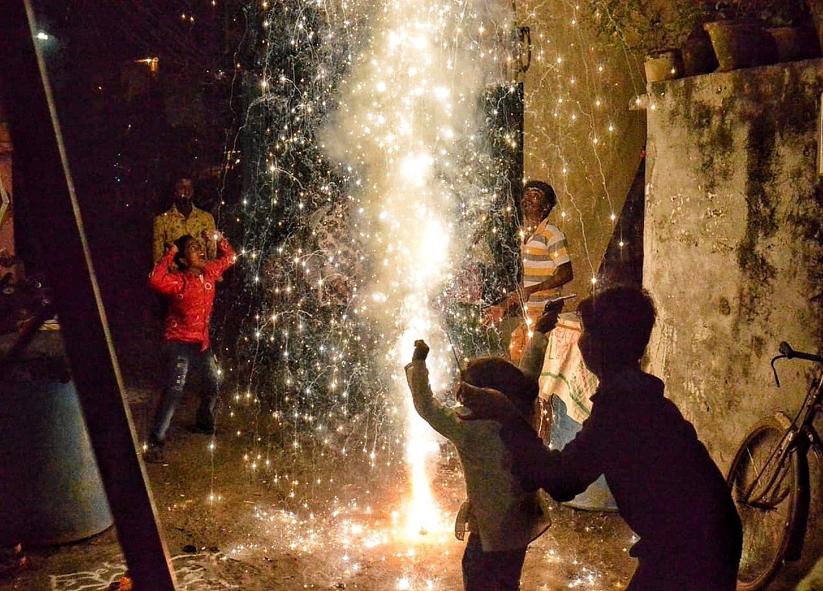 Children burn firecrackers on Diwali in Delhi, Nov 4, 2021