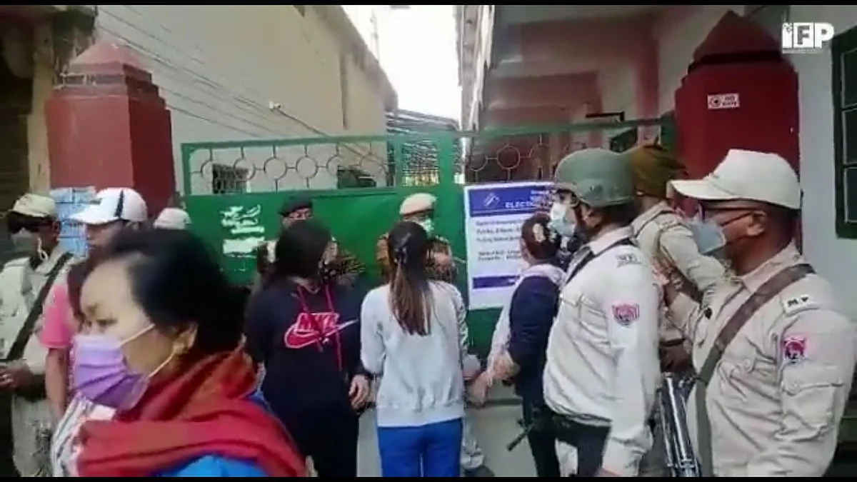 Voters argue in front of a polling station at Wangkhei