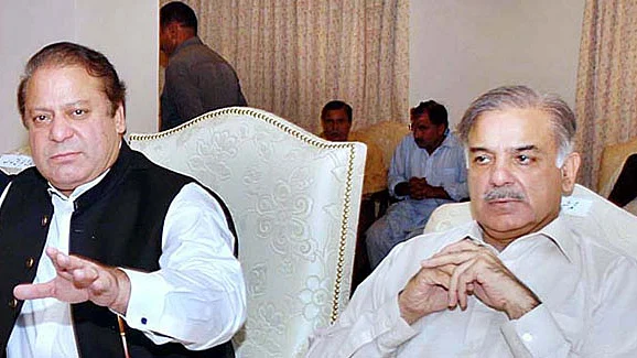 New Pakistan PM Shehbaz Sharif (right) with ex-PM and elder brother Nawaz Sharif
