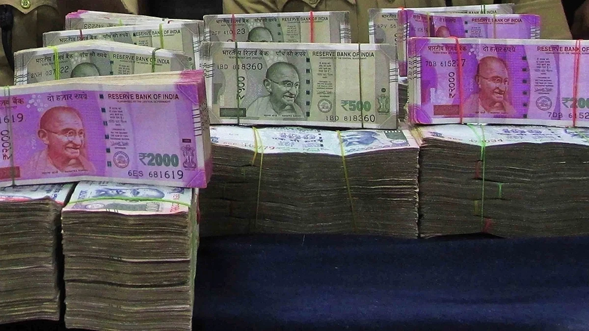 Rupee swings sharply in early trade amid crude relief and trade deal worries