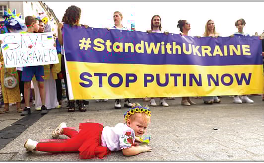 People attend a march in Krakow, Poland, on the Independence Day of Ukraine