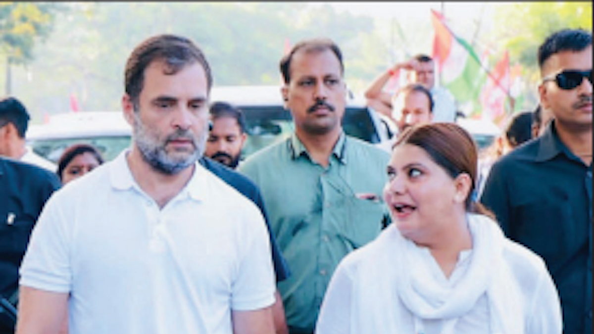 Noori Khan walking with Rahul Gandhi (Photos: Twitter/@INC)