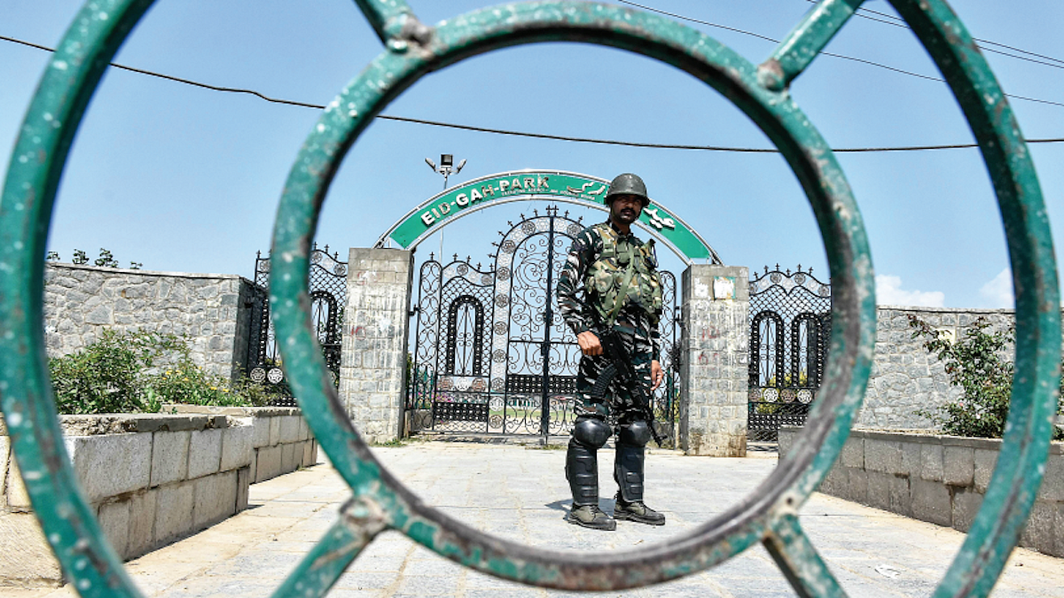 A paramilitary trooper stands guard outside Eidgah in old city Srinagar, Sept 2021 (Photos: Getty Images)