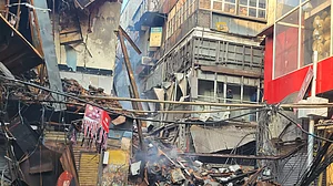 Smoke emanates from gutted shops in Chandni Chowk on 5th day; fire fighting still on