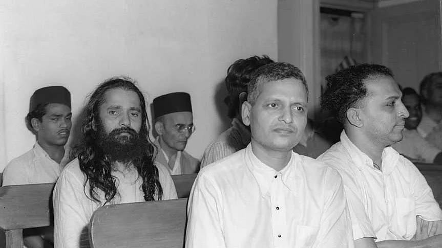 V.D. Savarkar (seated in the last row wearing a black cap); Nathuram Godse and Narayan Apte (right) are in the front row during the trial of Mahatma Gandhi’s assassins at Red Fort, 27 May 1948