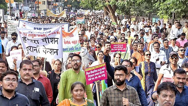 Gujarat government employees participate in a protest march over various demands including restoration of the old pension scheme, in Rajkot, Sept 2022