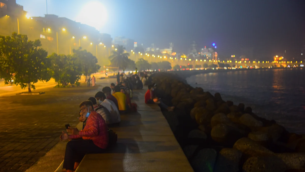 People spend time on New year's eve at Marine Drive on December 31, 2020 in Mumbai, India.
