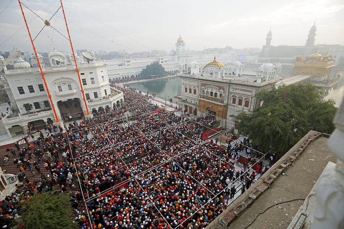 Amritsar: Devotees in large numbers to visit the Golden Temple on the occasion of New Year 2023, in Amritsar on January 1, 2023.