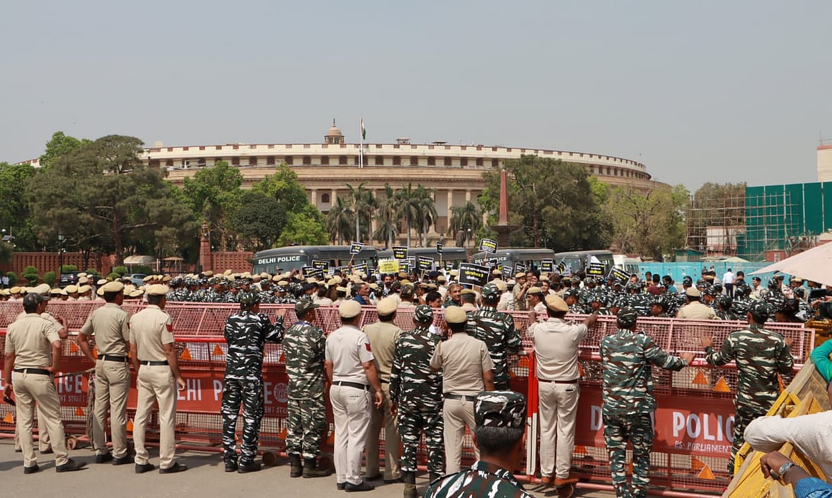 The Delhi Police implemented increased security measures outside the Enforcement Directorate's office during the protest march.