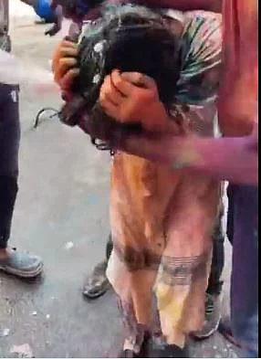 A Japanese tourist woman being molested in Delhi on Holi