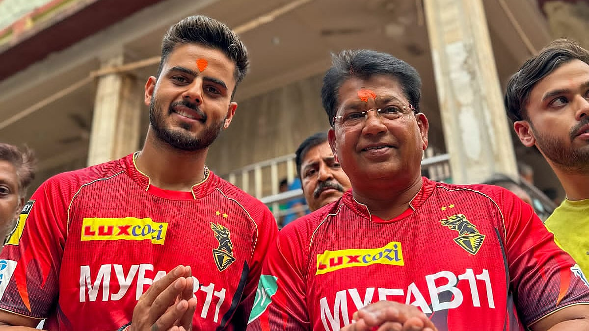 Chandrakant Pandit and Nitish Rana, the KKR head coach and stand-in skipper, offer prayers at the Kalighat temple in Kolkata.