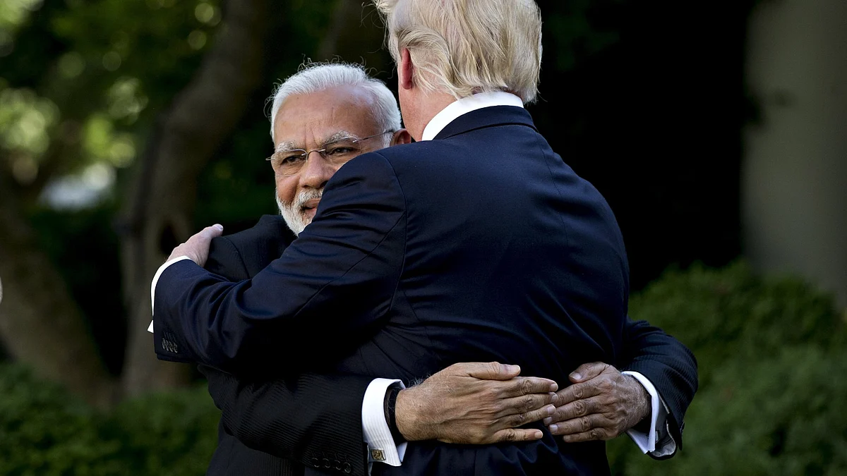 Indian PM Narendra Modi gives a bear hug to Trump at the White House, 26 June 2017.