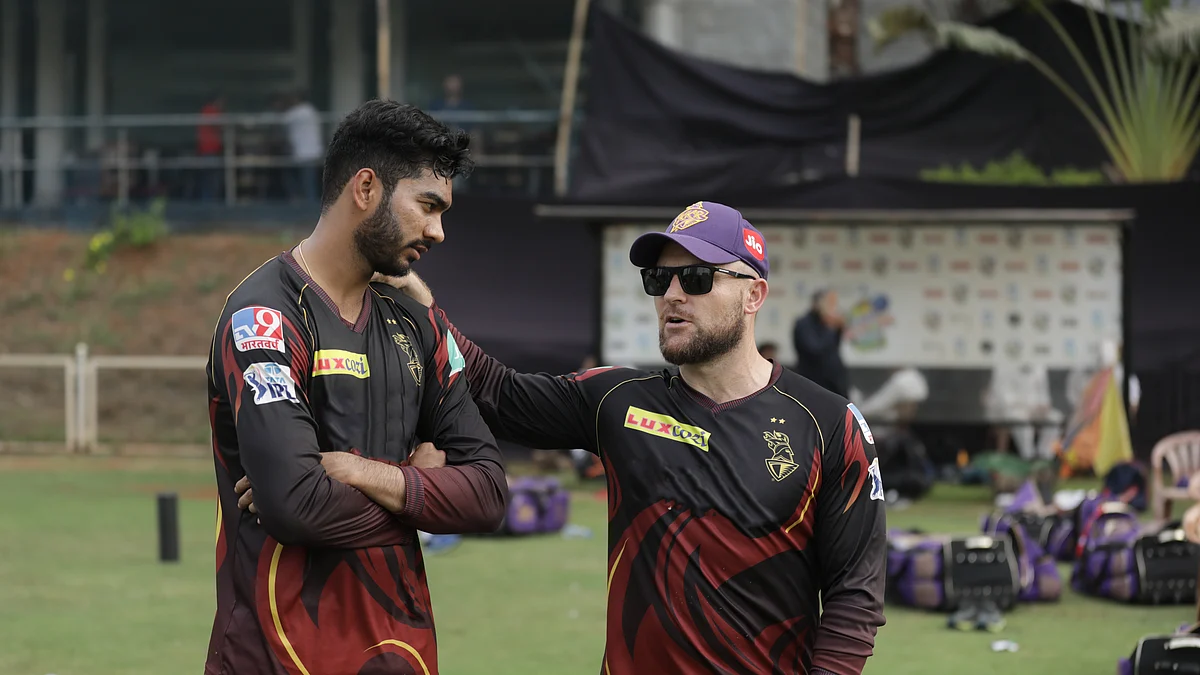 Venkatesh Iyer (left) has a chat with the then KKR coach, Brendon Mccullum - the pair being the only two centurions for the franchise in the history of IPL.  
