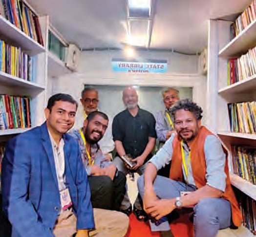 Inside the mobile library with (left to right)
DC Dumka Ravishankar Shukla, Akshaya
Bahibala, Naveen Kishore, Ravi Singh, Bikram
Grewal and Chandrahas Choudhury.