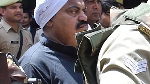 Atiq Ahmed surrounded by a police cordon (photo: IANS)