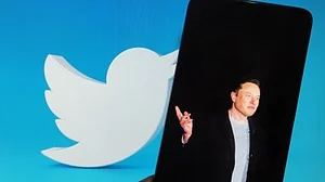 Twitter CEO Elon Musk with its iconic bird logo (photo: IANS)