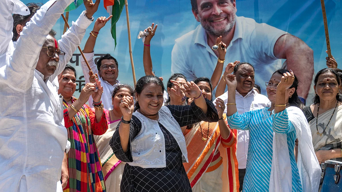 Congress workers in Mumbai celebrate as their party sweeps the Karnataka elections, 13 May 2023. (Photo by Satish Bate/Hindustan Times via Getty Images)
