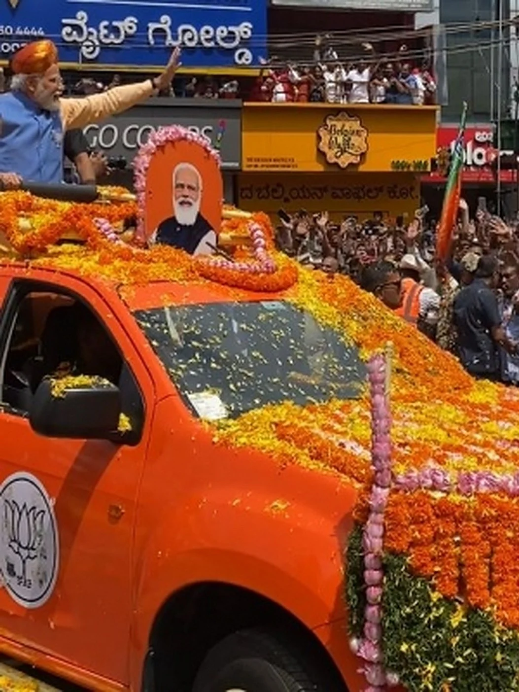 Prime Minister Narendra Modi on Saturday began his mega roadshow in Bangalore as part of his election campaign for the May 10 Assembly polls (Photo: IANS)