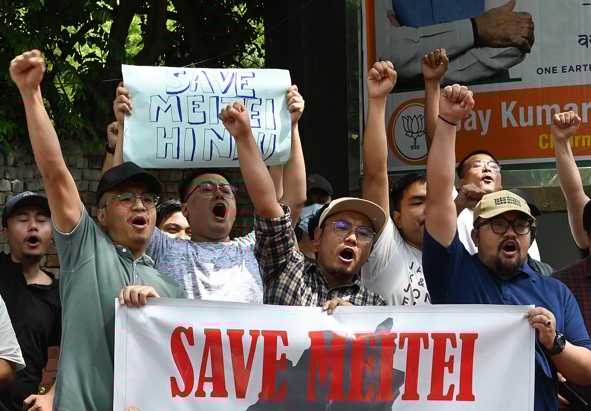 People from Manipur's Meitei community stage a demonstration at Jantar Mantar against the ongoing violence in the  state. Posters highlight the Meitei identity as 'Hindu', presumably to appeal to the ruling government at the Centre (photo: Getty Images)