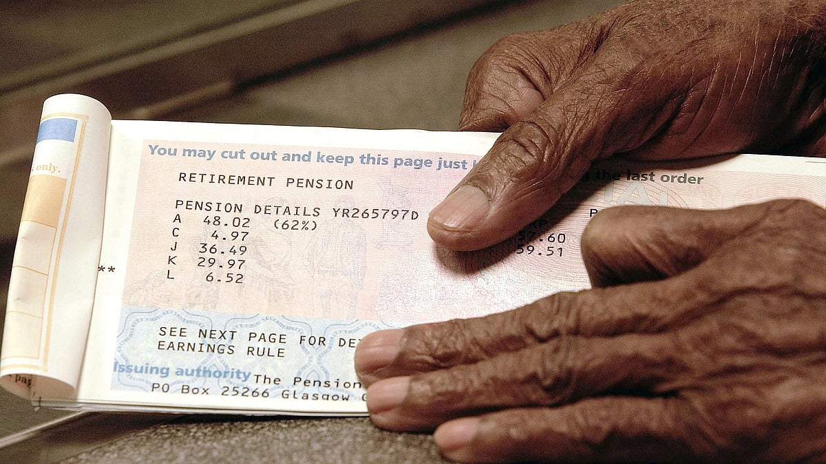 Representative image of an elderly individual handling their pension book (photo: Getty Images)