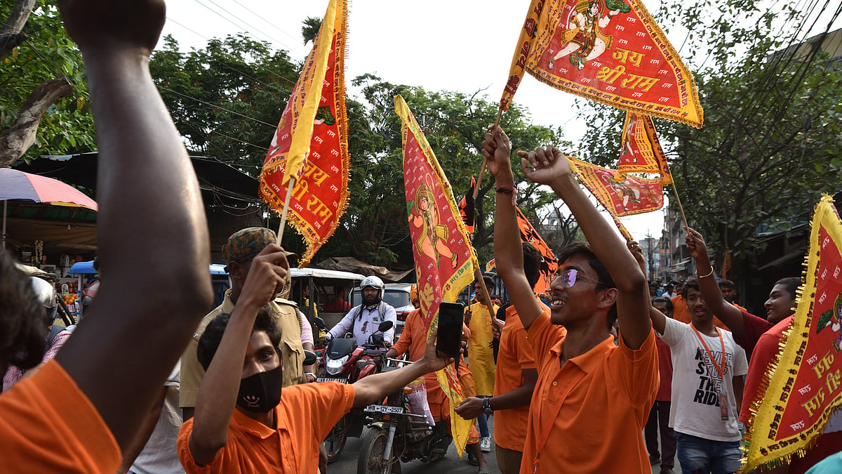 Representative image of Hindus in saffron t-shirts celebrating with flags that say 'Jai Shri Ram' (photo: Getty Images)