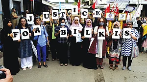 Activists in Mumbai, holding up placards that combine to call for 'Justice for Bilkis', during a protest against the release of the men convicted of her gang-rape during the 2002 Gujarat riots (photo: Getty Images)