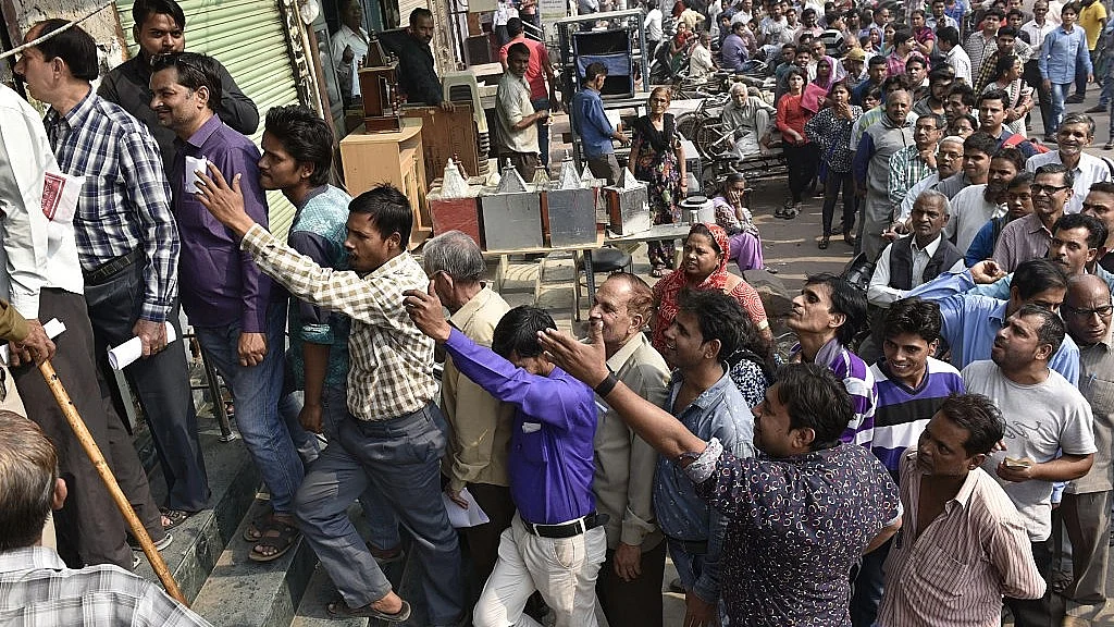 Photo of long queues formed outside banks across India as people scrambled to obtain legal tender after the Central Government demonetised Rs. 500 and Rs 1,000 notes on November 8, 2016. (Photo Courtesy Arvind Yadav/ Hindustan Times)