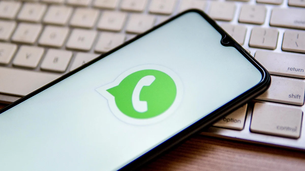 In this photo illustration, a WhatsApp logo is displayed on a smartphone on top of a computer keyboard. (Photo Illustration by Thiago Prudencio/SOPA Images/LightRocket via Getty Images)