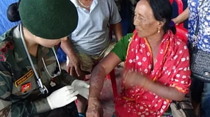 An army doctor treating a victim of violence in Manipur (IANS Photo)