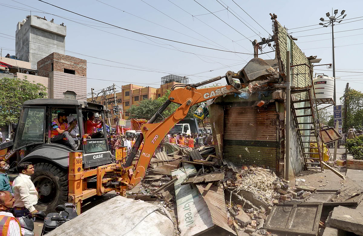Locals protest outside temple in Delhi's Mandawali during encroachment drive by PWD