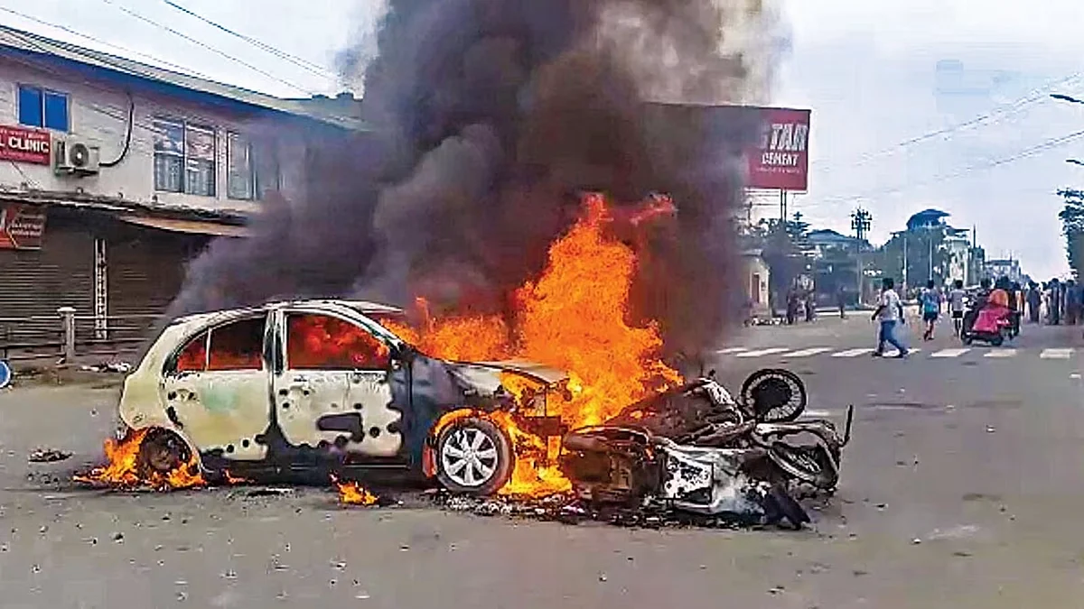 Vehicles ablaze after violence broke out during the 'Tribal Solidarity March' called by All Tribal Student Union Manipur in Imphal on Thursday, May 4. (Photo Courtesy: PTI)