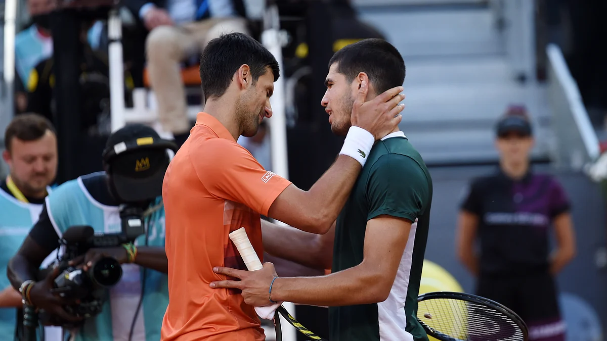 Novak Djokovic (left) of Serbia and Carlos Alcaraz of Spain after their Men's Singles Semi-finals match during day ten of Mutua Madrid Open at La Caja Magica on May 07, 2022 in Madrid, Spain. (Photo: Denis Doyle/Getty Images)