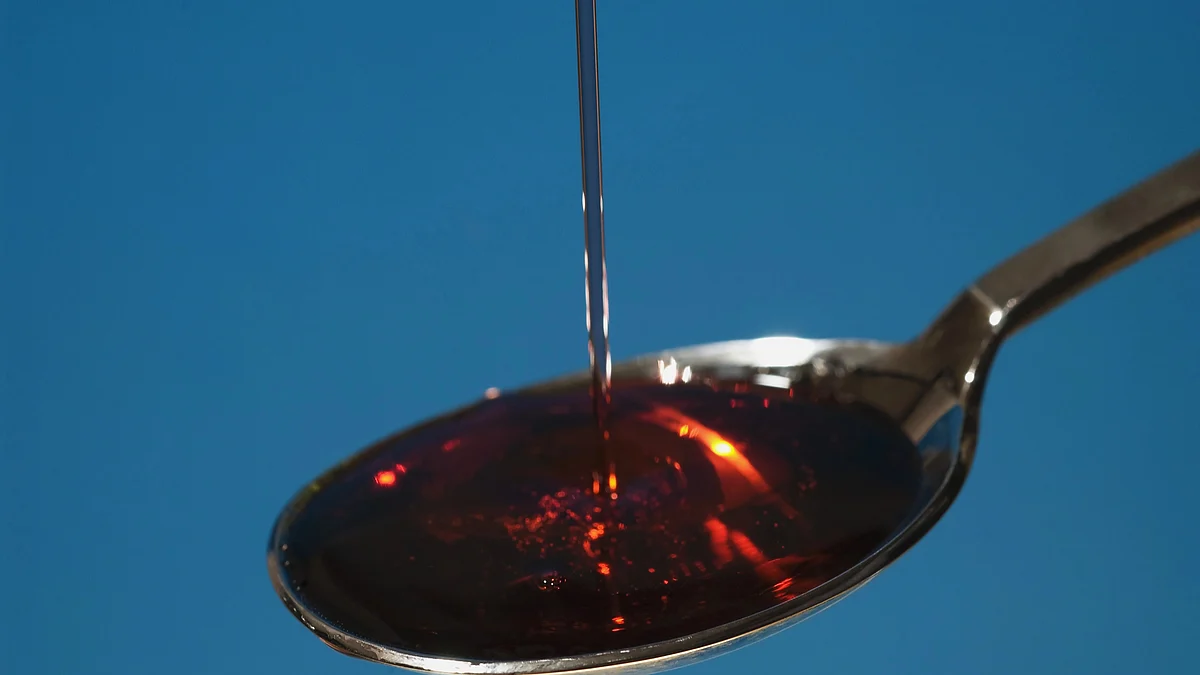 Cough syrup poured onto spoon, close-up (Photo by Universal Images Group via Getty Images)