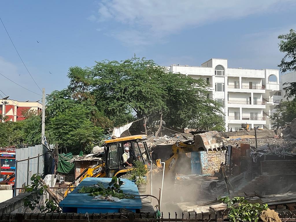 A bulldozer in action (Photo courtesy: AICCTU)
