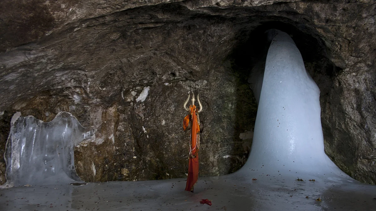 The phallic form of the icy stalagmite worshipped by Hindus as a 'living' embodiment of the god Shiva in Baltal, Jammu and Kashmir (photo: Yawar Nazir/Getty Images)