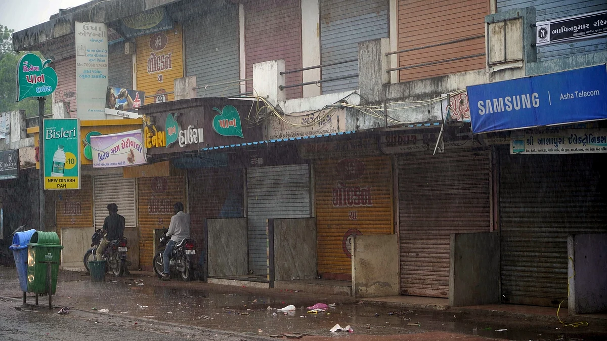 Heavy rain lashes as shops remain closed as part of precautionary measures ahead of the landfall of Cyclone Biparjoy, at Mandvi in Kutch district, on Thursday, June 15, 2023. (photo: IANS)