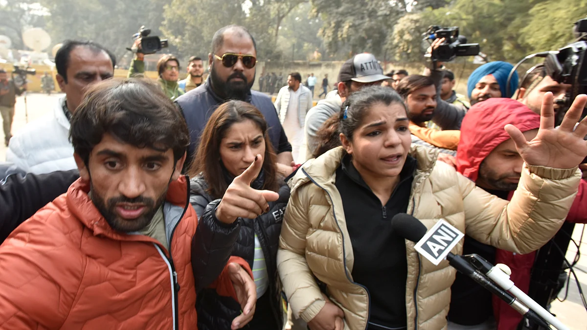 Wrestlers Vinesh Phogat, Sakshi Malik, and Bajrang Punia during the protest at Jantar Mantar on January 19, 2023, in New Delhi. (photo: Getty Images)