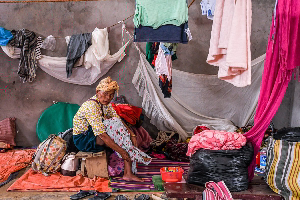 Churachandpur, Manipur: An elderly woman dresses at a makeshift relief camp in Saidan village (photo: Getty Images)