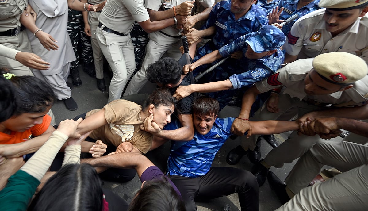 The Delhi police scuffled with the wrestlers as they attempted to march towards the new Parliament building, on May 28, 2023 in New Delhi, India. (Photo by Sanjeev Verma/Hindustan Times via Getty Images)